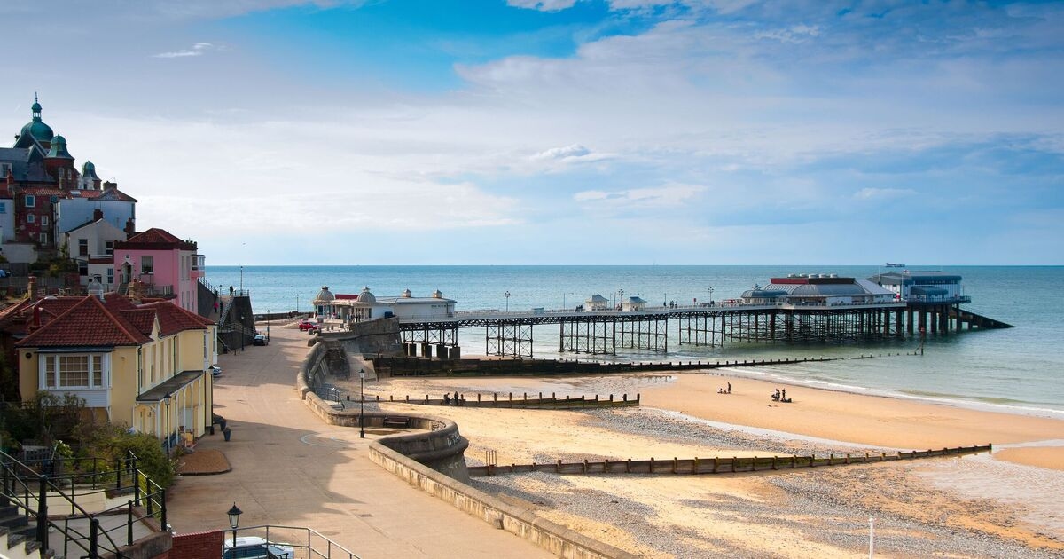 Unspoilt UK seaside town with traditional Victorian pier that was once split in two