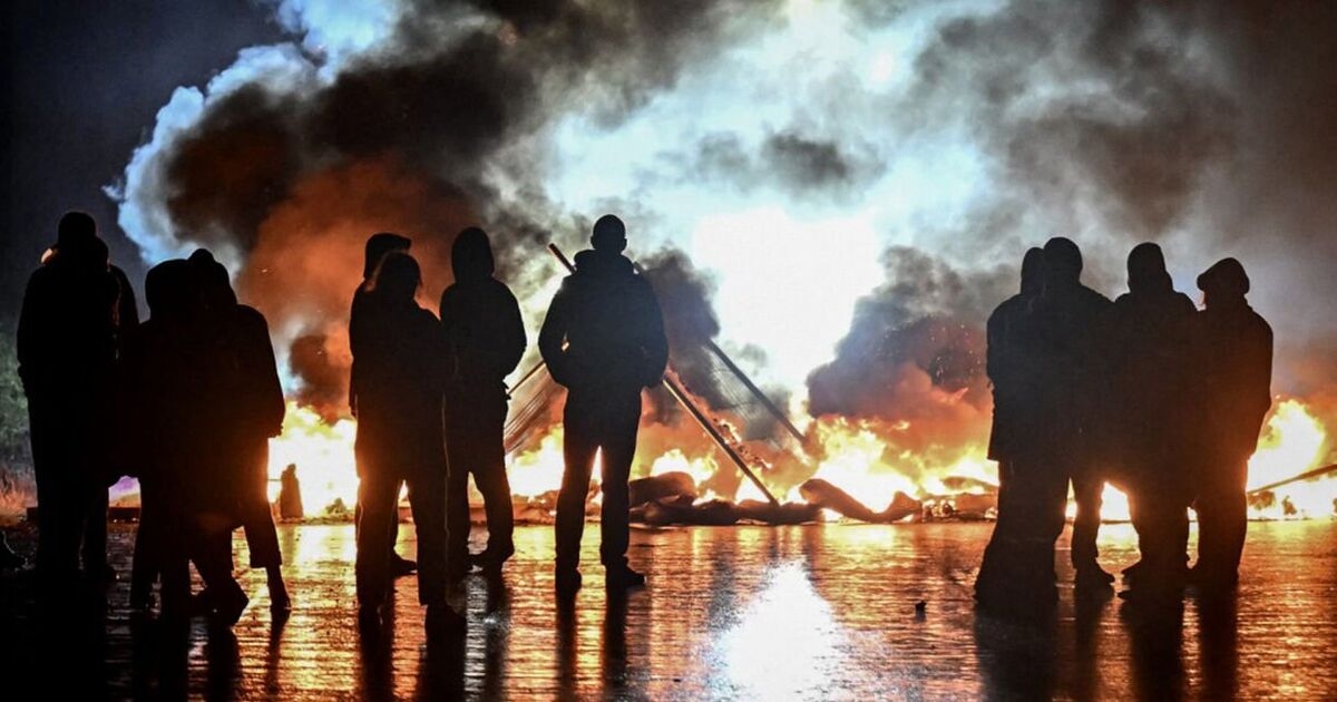 Paris riots LIVE: Police scramble across street launching gas canisters into masked crowds