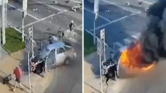 Belgorod'da bir araca drone çarptı. Patlama ve kaçış. Video.