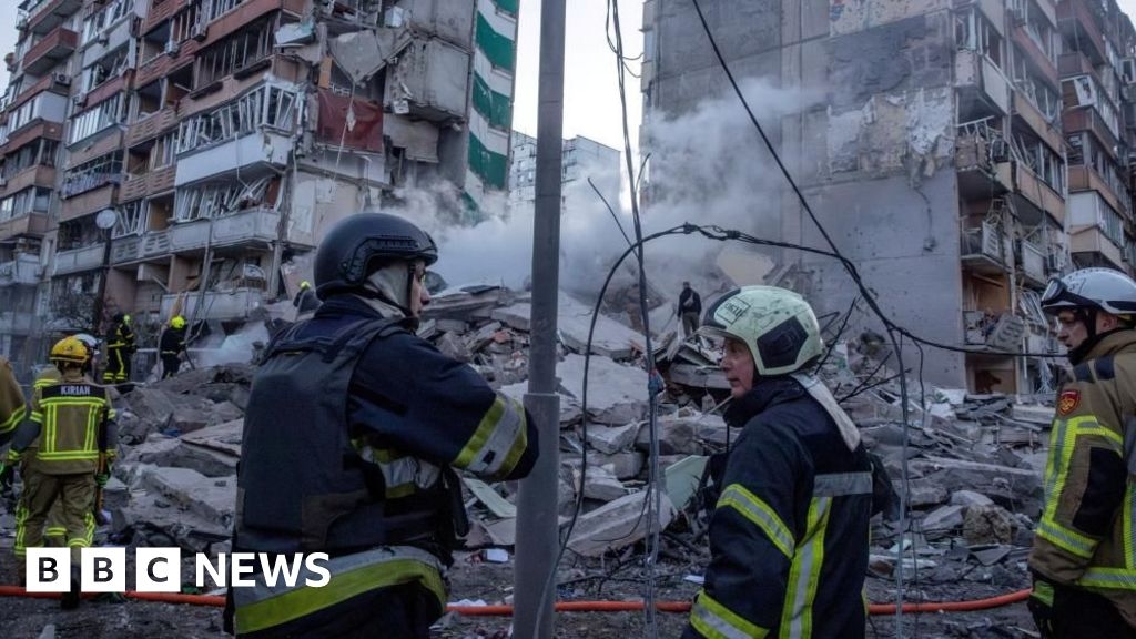 Rescuers search rubble of Kyiv flats after massive Russian strikes kill two