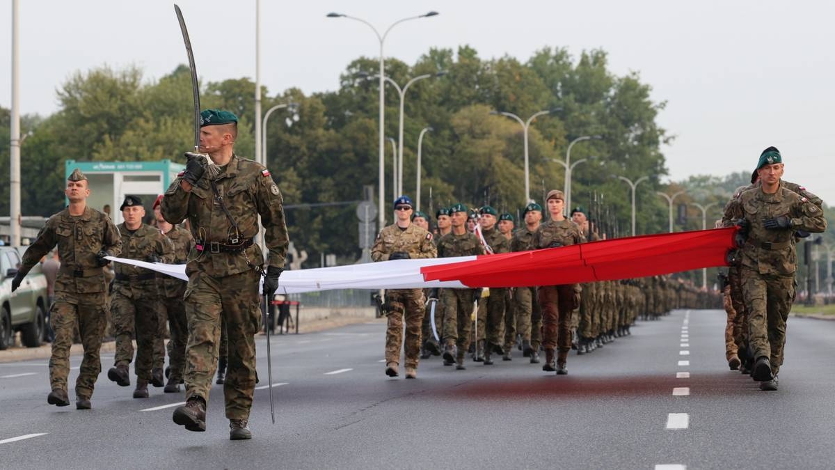 "The biggest in history." The military is training for the parade, and heavy equipment is on the streets.