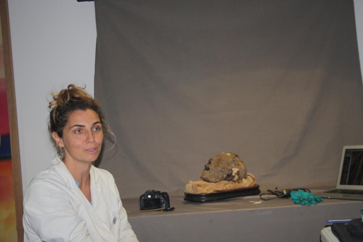 Unusual. The mysterious mummified head gets a facelift at the Royan museum.