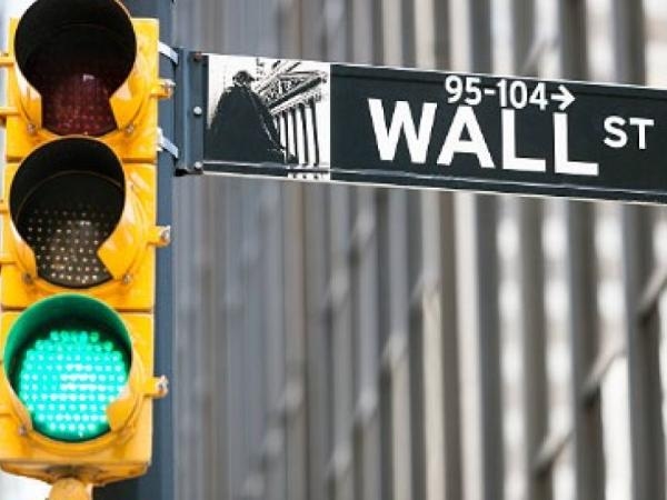 Wall Street closes at record highs after US rate cuts and Intel rise